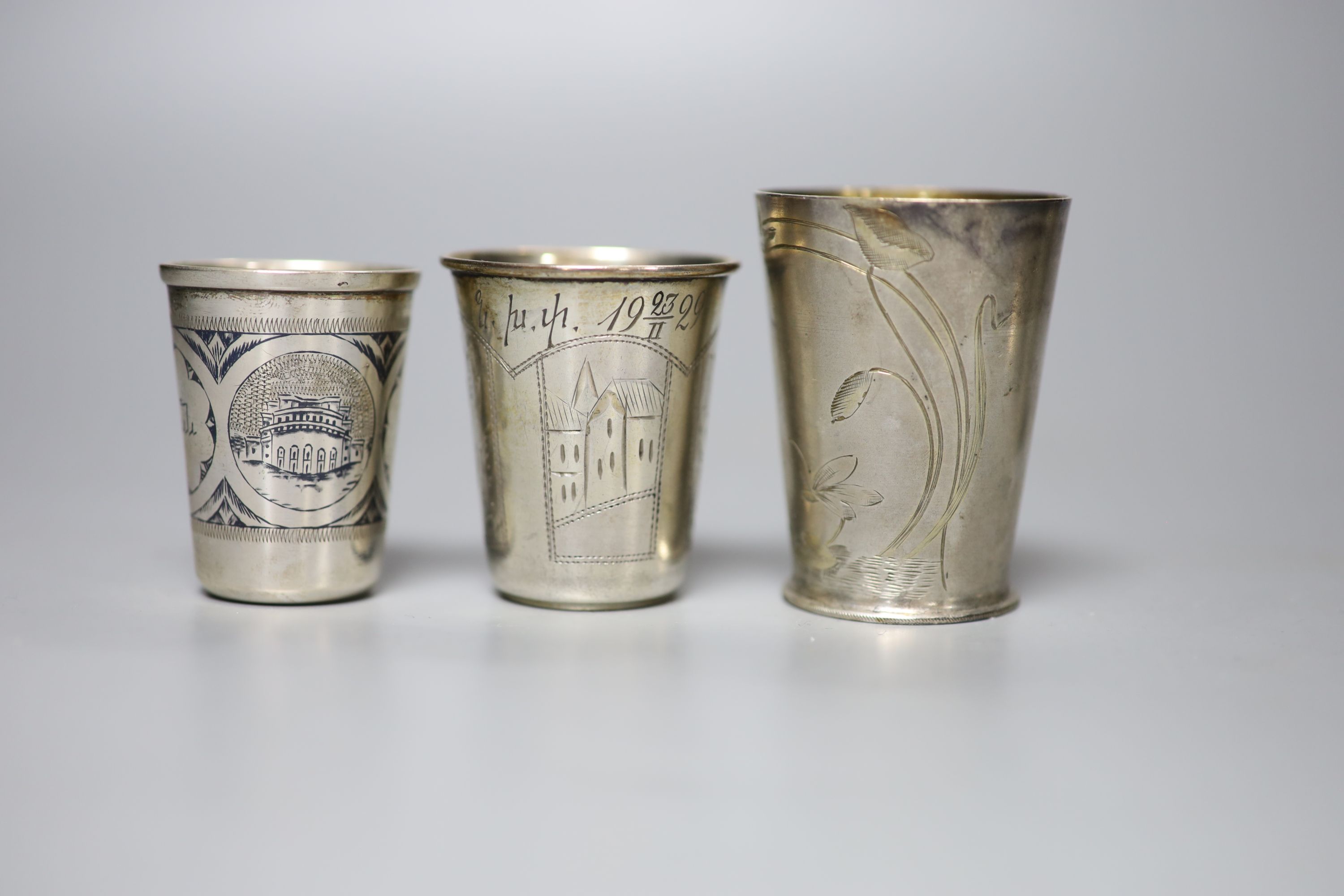 Six assorted early 20th century Russian 84 zolotnik tots, tallest 74mm, a similar enamelled bracelet and a filligree box